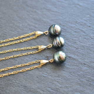 Tahitian pearl bail necklace featuring a large black pearl on a silver chain, elegant jewelry by Yay Hawaii.