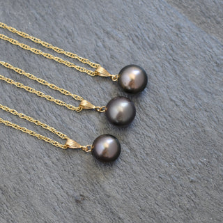Elegant round Tahitian pearl bail necklace by Yay Hawaii featuring a lustrous black pearl on a delicate chain.