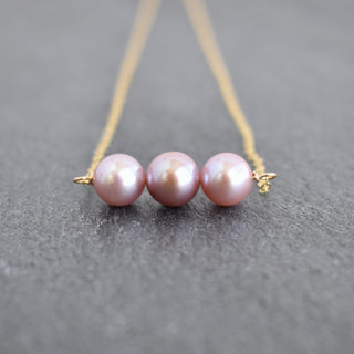 Light pink and purple pearl necklace with 8mm pearls, by Yay Hawaii, showcasing a close-up of the elegant jewelry piece.