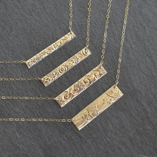 Patterned Hawaiian heirloom-style bar necklace by Yay Hawaii featuring tropical-inspired designs on polished metal.