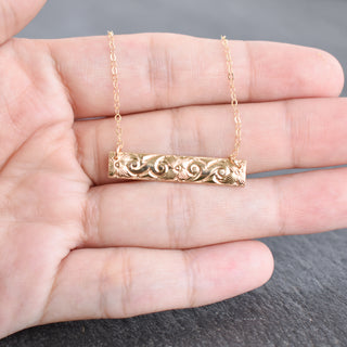 Patterned Hawaiian heirloom style bar necklace by Yay Hawaii featuring intricate tropical-inspired designs on a sleek metal bar.