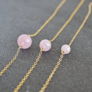 Yay Hawaii single rose quartz station necklace with 6mm, 8mm, or 10mm beads on a delicate chain, showcasing the pink gemstone.