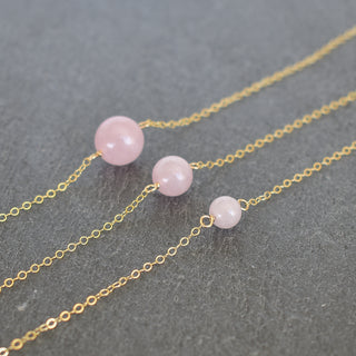 Yay Hawaii single rose quartz station necklace with 6mm, 8mm, or 10mm beads on a delicate chain, showcasing the pink gemstone pendant.