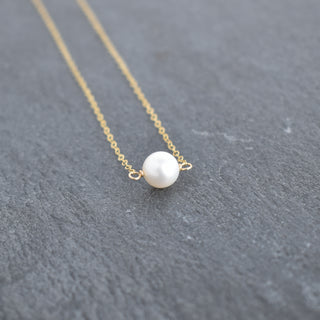 Dainty 8mm white pearl station necklace by Yay Hawaii featuring evenly spaced pearl beads on a delicate chain