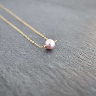 Dainty 8mm purple pearl station necklace from Yay Hawaii featuring evenly spaced single pearls on a delicate chain.