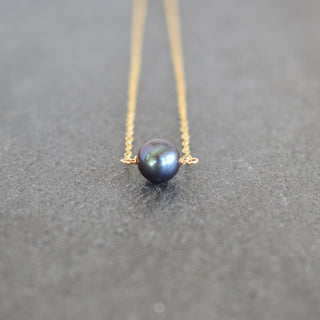Black 8mm freshwater pearl station bar necklace by Yay Hawaii, featuring a sleek design with evenly spaced pearls on a delicate chain.