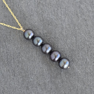 Freshwater pearl necklace featuring five elegant pearls, designed by Yay Hawaii, showcased on a neutral background.