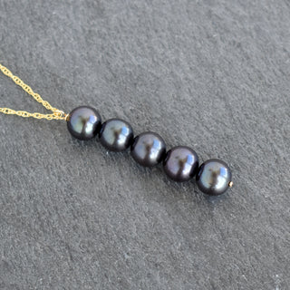 Yay Hawaii statement five freshwater pearl necklace featuring five elegant white pearls on a delicate chain.