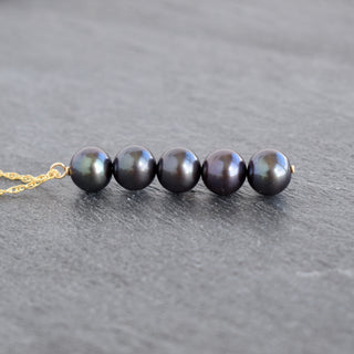 Elegant freshwater pearl necklace with five statement pearls from Yay Hawaii, showcasing a sophisticated jewelry piece.