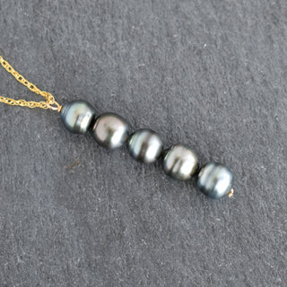 Vertical pendant necklace featuring five Tahitian pearls on a silver chain, designed by Yay Hawaii.