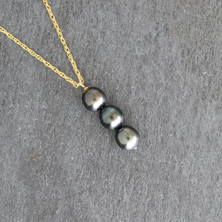 Tahitian pearl vertical pendant necklace by Yay Hawaii featuring a single black pearl on a delicate chain.