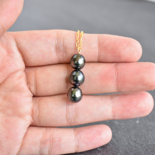 Tahitian pearl vertical pendant necklace by Yay Hawaii featuring three dark, lustrous pearls on a delicate chain.