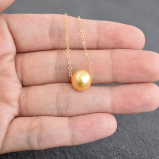 Golden freshwater floating pearl necklace by Yay Hawaii featuring elegant freshwater pearls on a delicate chain.
