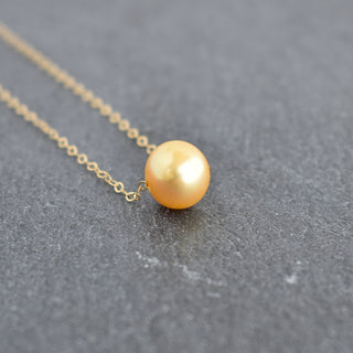 Golden freshwater floating pearl necklace by Yay Hawaii featuring a delicate chain with elegant floating pearls.
