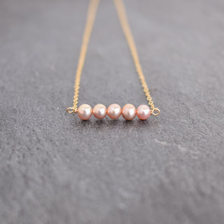 Light purple seed pearl station necklace featuring tiny 4mm pearls, crafted by Yay Hawaii, with a delicate and elegant design.