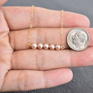 Tiny 4mm light purple seed pearl station necklace featuring small, round pearls on a delicate chain by Yay Hawaii.