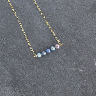 Tiny 4mm peacock seed pearl station necklace featuring small, lustrous pearls on a delicate chain, by Yay Hawaii.