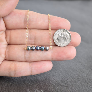 Tiny 4mm peacock seed pearl station necklace by Yay Hawaii featuring small, lustrous pearl beads on a delicate chain.
