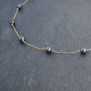 Dainty 8mm black freshwater pearl station necklace by Yay Hawaii, featuring evenly spaced pearls on a delicate chain.