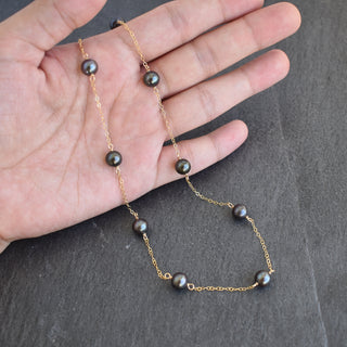 Dainty 8mm black freshwater pearl station necklace by Yay Hawaii showcasing smooth, lustrous pearls on a delicate chain.