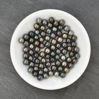 Tiare and Tahitian pearl bypass ring by Yay Hawaii featuring a floral design with black Tahitian pearls and silver band.