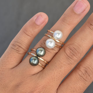 White pearl double bypass ring by Yay Hawaii featuring two overlapping pearl accents on a silver band.