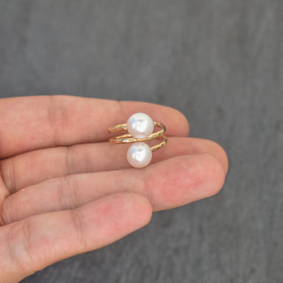 White pearl double bypass ring by Yay Hawaii featuring two overlapping bands with lustrous pearls on a silver setting.