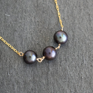 Black pearl station necklace by Yay Hawaii with three evenly spaced pearls on a delicate chain.