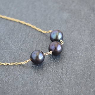 Black pearl station necklace featuring three pearls on a delicate chain, by Yay Hawaii.