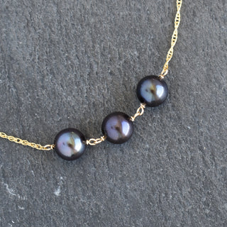 Black pearl station necklace featuring three pearls on a delicate chain, by Yay Hawaii.