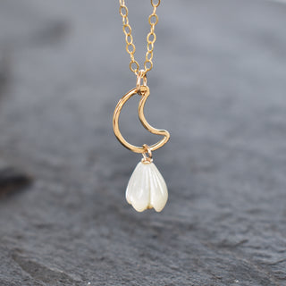 Silver crescent moon necklace featuring a small Pikake flower pendant, designed by Yay Hawaii, displayed against a neutral background.