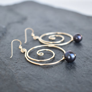 Large black pearl spiral earrings by Yay Hawaii featuring elegant, coiled design and shiny black pearls.