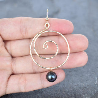 Large black pearl spiral earrings by Yay Hawaii featuring elegant, swirling design with shiny black pearls on silver hooks.