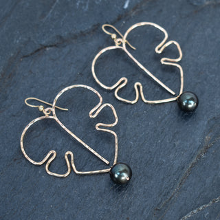 Extra large Monstera leaf earrings with black pearls in silver or gold, showcasing a bold tropical jewelry design.