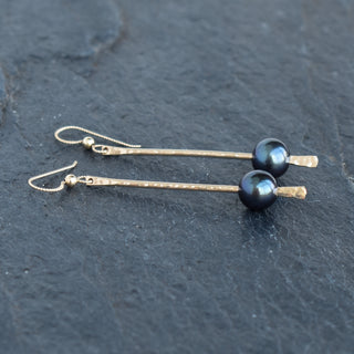 Dangling pearl earrings featuring Tahitian or freshwater pearls from Yay Hawaii, with elegant silver hooks.