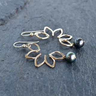 Large Naupaka earrings by Yay Hawaii featuring intricate silver floral designs on hooks.