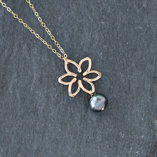 Small Tiare necklace by Yay Hawaii featuring a dangling pearl and tropical floral design on a delicate chain.