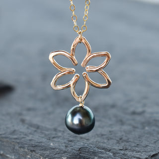 Small Tiare necklace by Yay Hawaii featuring a dangling pearl, designed with tropical floral accents and delicate chain.
