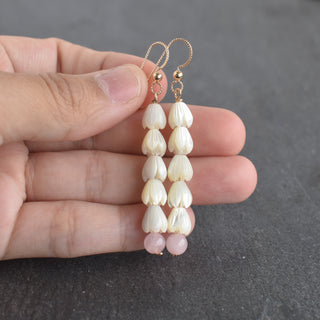 Five small mother of pearl Pikake flowers and 6mm rose quartz long earrings by Yay Hawaii, featuring floral and gemstone details.