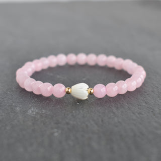 6mm rose quartz stretchy bracelet with small Pikake flower charm by Yay Hawaii, featuring polished pink gemstone beads.