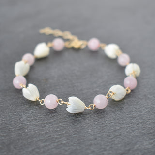 Linked 6mm rose quartz and small pikake bracelet by Yay Hawaii, featuring elegant gemstone beads and optional extender.