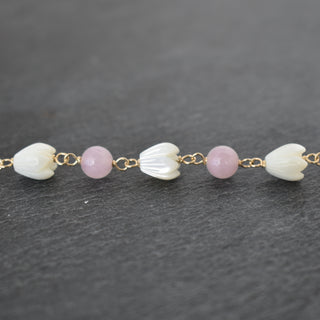 Linked 6mm rose quartz and small pikake bracelet by Yay Hawaii, featuring polished pink stones and delicate floral accents.