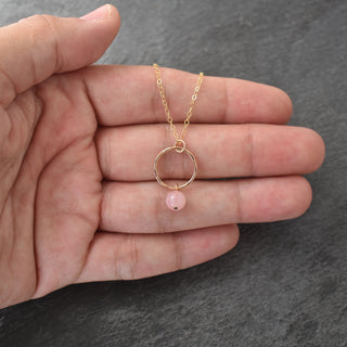 Small hoop necklace by Yay Hawaii featuring a dangling 6mm rose quartz pendant, delicate jewelry with a minimalist style.