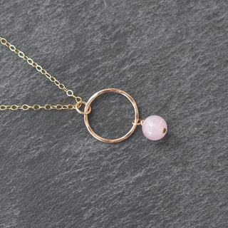 Small hoop necklace by Yay Hawaii featuring a dangling 6mm rose quartz pendant on a delicate chain.