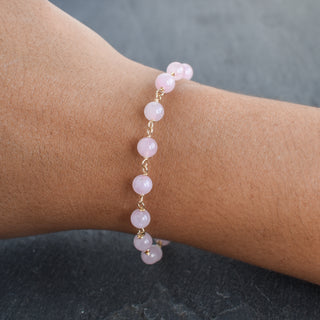 Linked rose quartz bracelet with extender chain, featuring polished pink gemstone beads and silver clasp, by Yay Hawaii.
