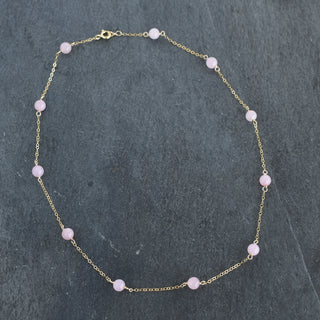 Six 6mm rose quartz beads on a Yay Hawaii station necklace, showcasing a delicate pink gemstone jewelry piece.