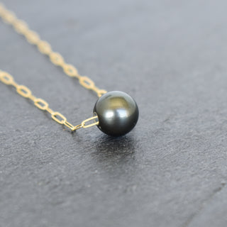 Round Tahitian pearl pendant on a silver paperclip chain, jewelry piece by Yay Hawaii featuring a lustrous black pearl.
