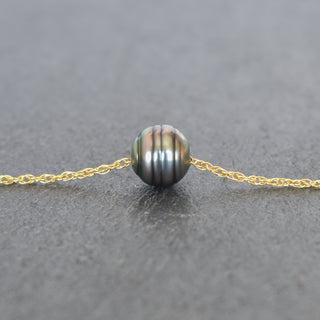 Tahitian pearl pendant on double rope chain necklace by Yay Hawaii, showcasing a lustrous dark pearl with intricate chain details.