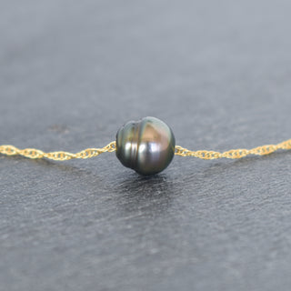 Tahitian pearl circle pendant on a double rope chain necklace by Yay Hawaii, showcasing elegant black pearl jewelry.