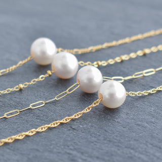 White freshwater pearl necklace with satellite chain by Yay Hawaii displayed on a white background.